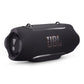 Black cylindrical portable speaker with woven fabric grille and orange logo