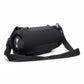 Black portable Bluetooth speaker with woven fabric grille and adjustable shoulder strap