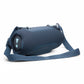 Blue portable Bluetooth speaker with fabric grille and attached shoulder strap