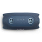 Blue portable Bluetooth speaker with fabric mesh exterior and rubberized control panel