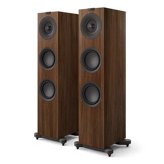 Pair of walnut floorstanding speakers with three black drivers and stabilizing feet