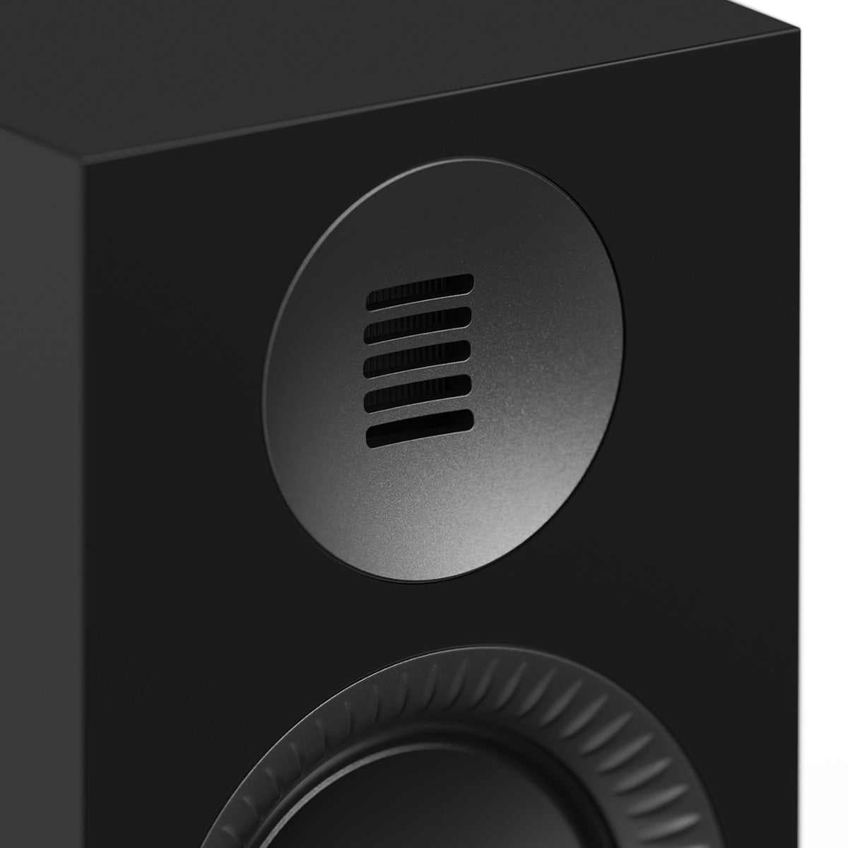 Matte black bookshelf speaker with a circular tweeter and a ribbed woofer surround
