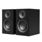 Matte black bookshelf speakers with a large woofer and a circular tweeter on each cabinet