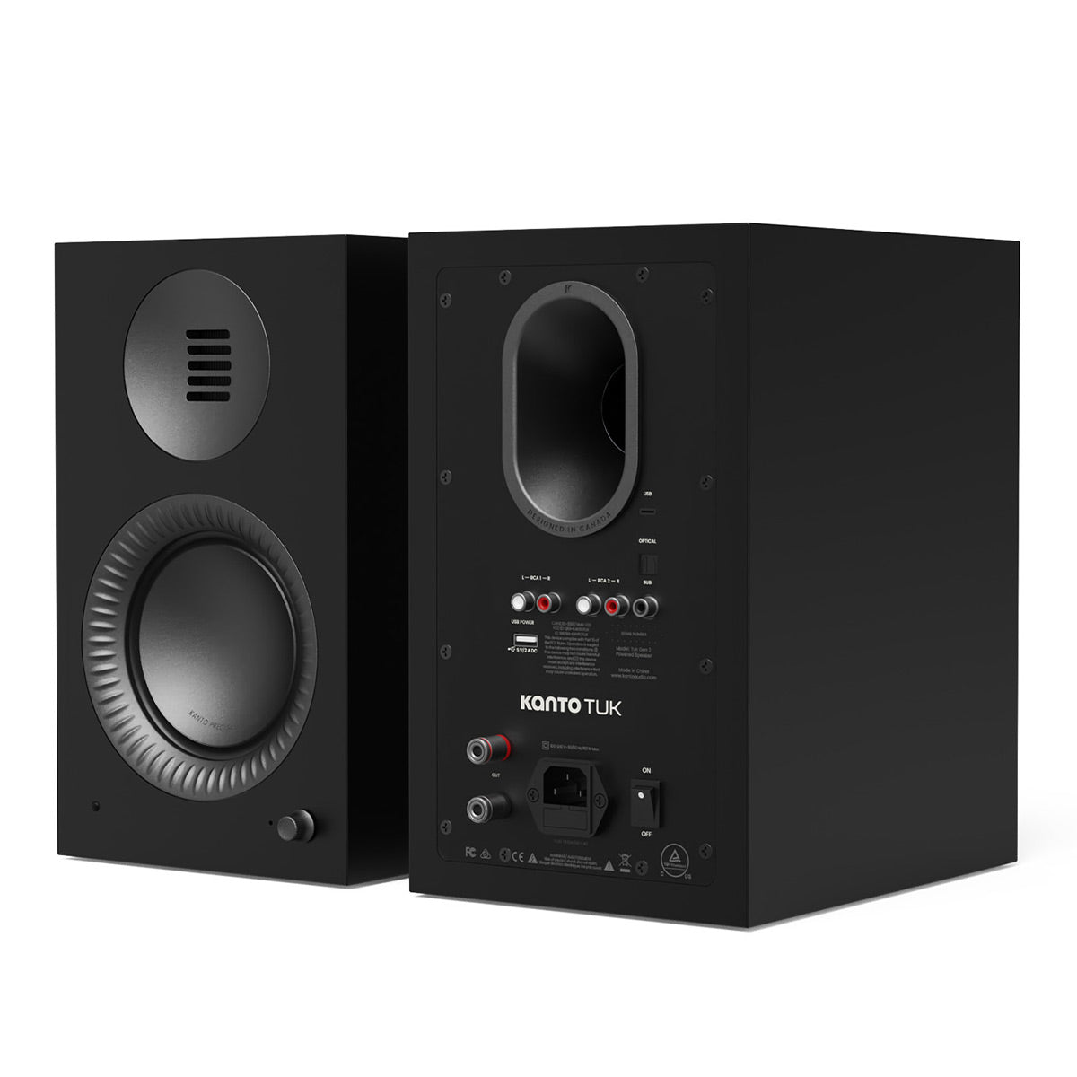 Matte black bookshelf speakers with front-facing woofer and rear panel featuring multiple input port