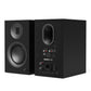 Matte black bookshelf speakers with front-facing woofer and rear panel featuring multiple input port