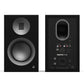 Matte black bookshelf speaker with a silver ribbon tweeter and a large woofer with a ribbed surround
