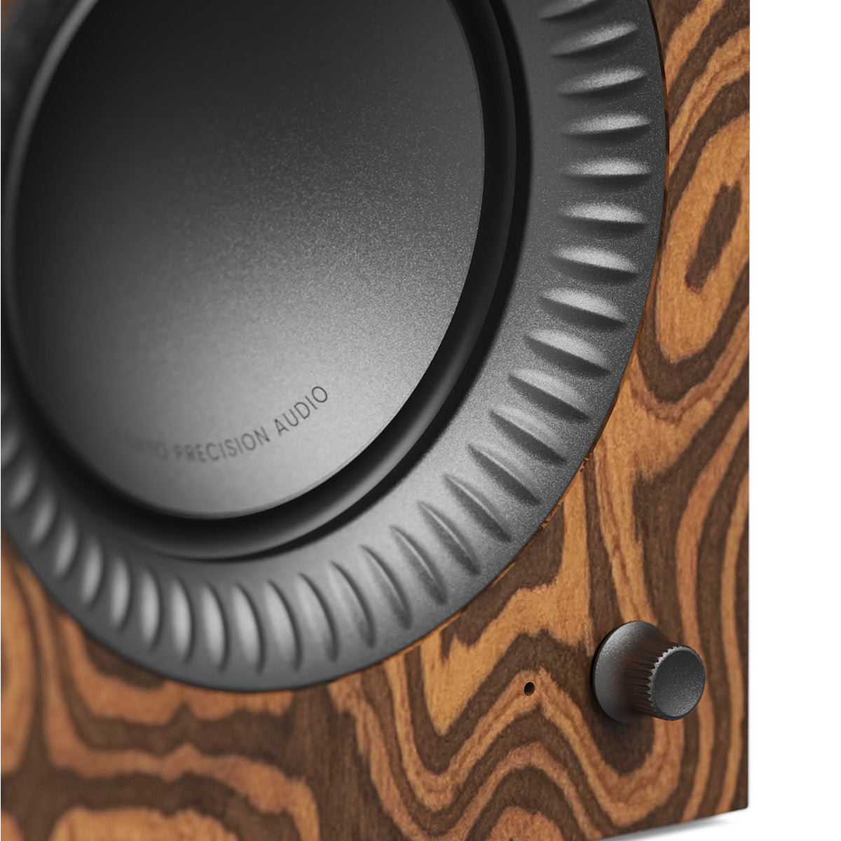 Wood-grain speaker cabinet with a black woofer and a textured rubber surround
