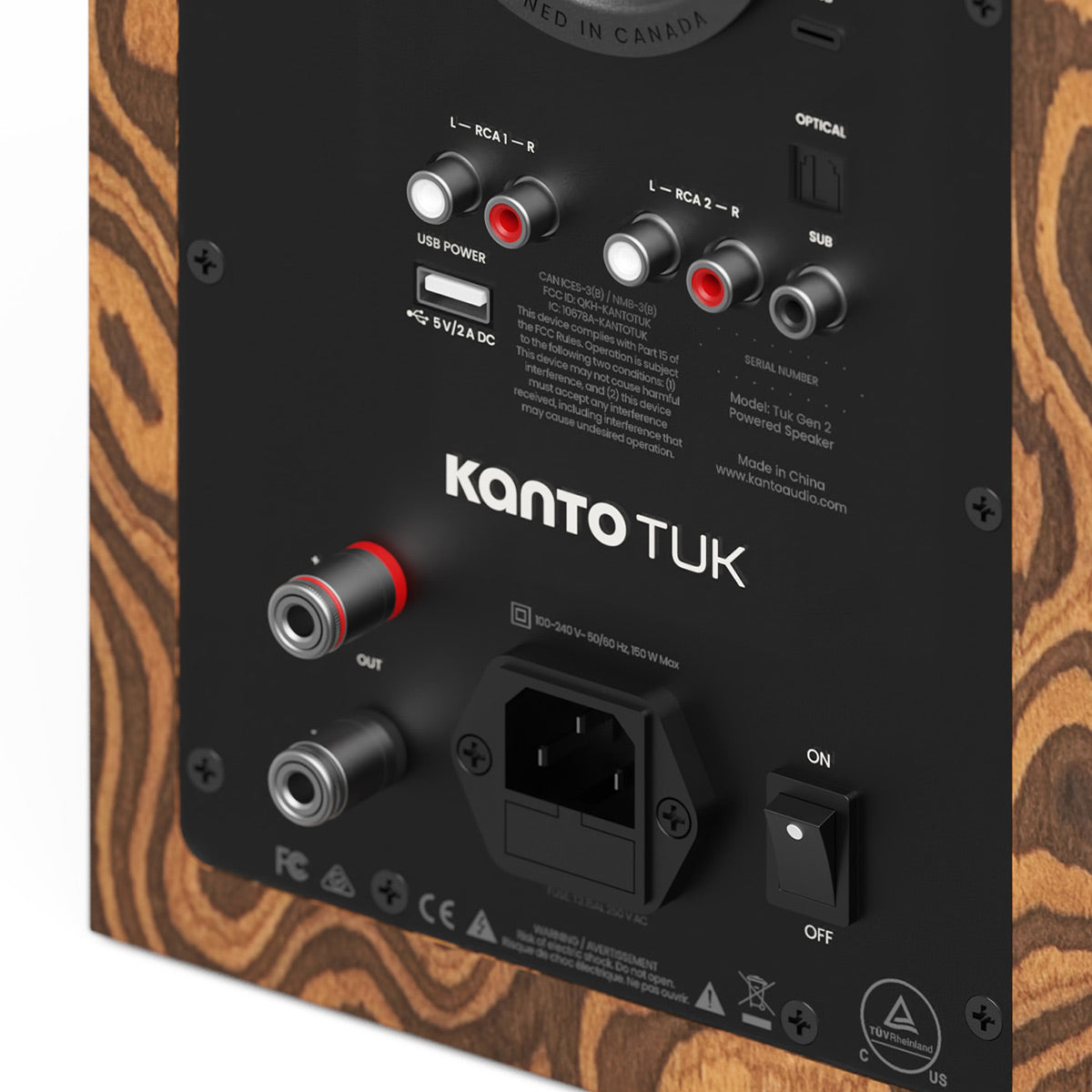 Back panel of a wood-grain speaker with RCA inputs, optical port, and power switch