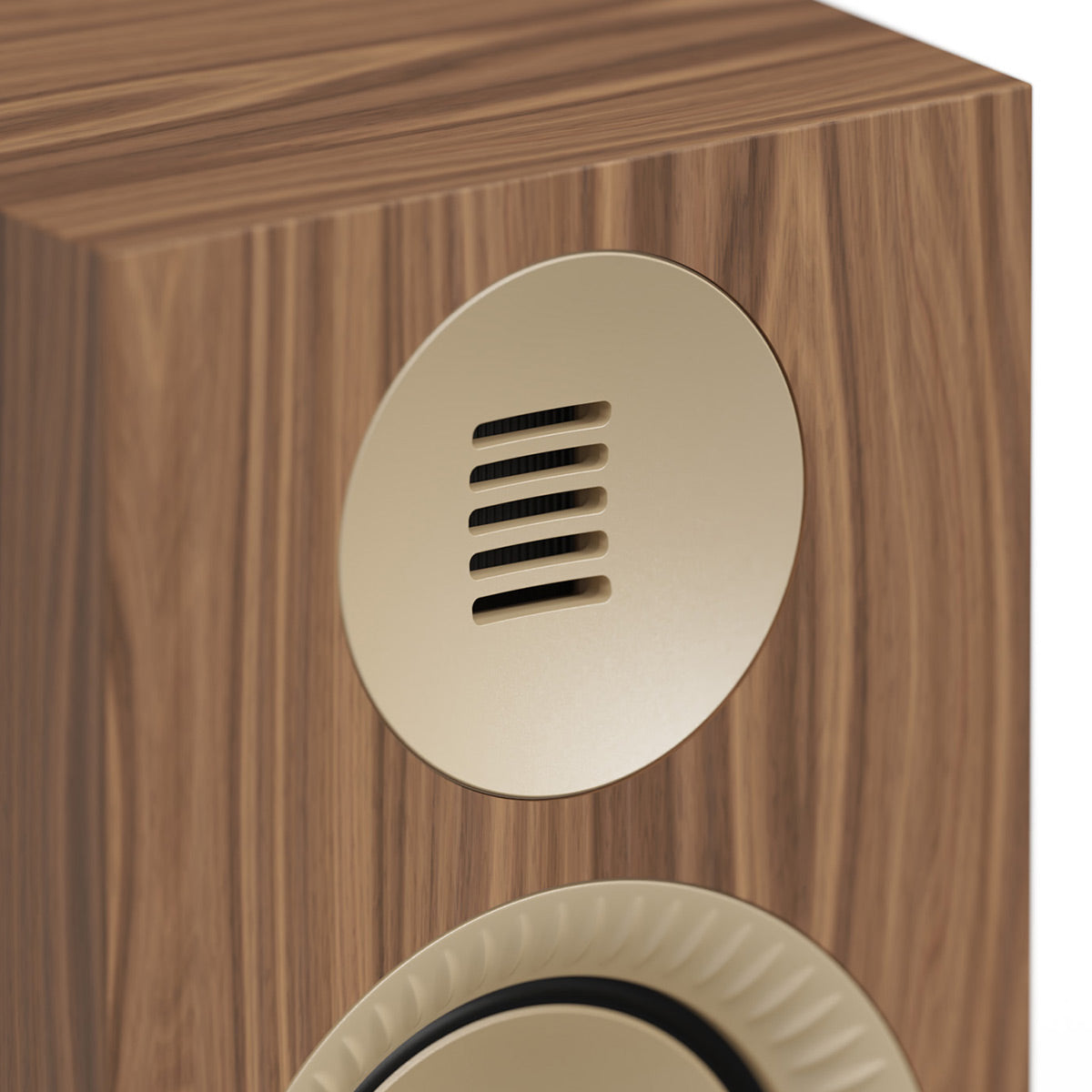 Walnut wood bookshelf speaker with a circular gold-tone tweeter and slotted vent