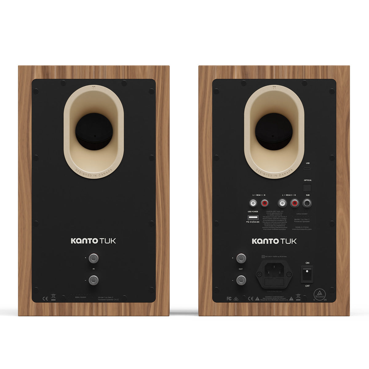 Pair of matte walnut bookshelf speakers with rear-facing ports and multiple input connections