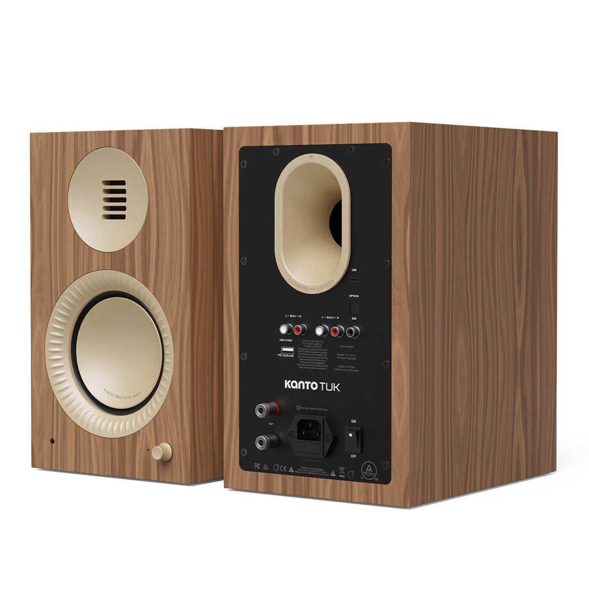 Pair of matte walnut bookshelf speakers with cream-colored drivers and rear input panel