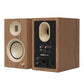 Pair of matte walnut bookshelf speakers with cream-colored drivers and rear input panel