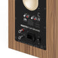 Matte walnut bookshelf speaker rear panel with RCA, optical, and USB inputs