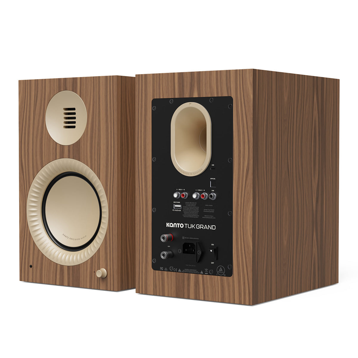 Pair of matte walnut bookshelf speakers with cream-colored drivers and rear input panel