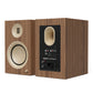 Pair of matte walnut bookshelf speakers with cream-colored drivers and rear input panel