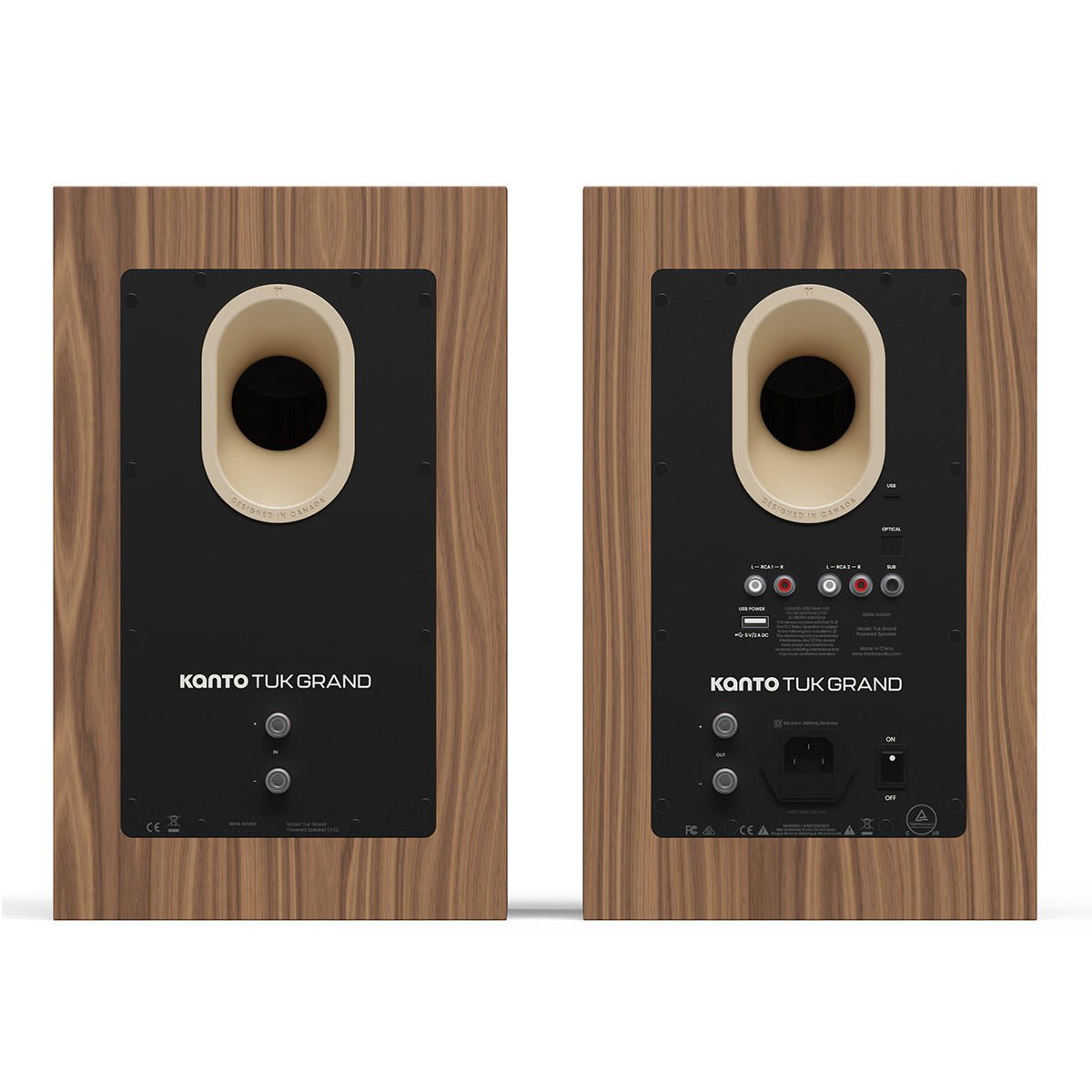 Pair of matte walnut bookshelf speakers showing rear panels with bass ports and input connections