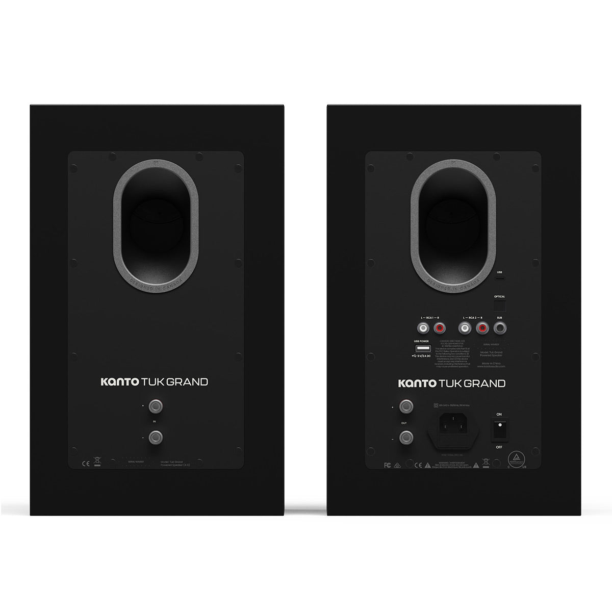 Matte black bookshelf speakers with rear bass ports and multiple input connections