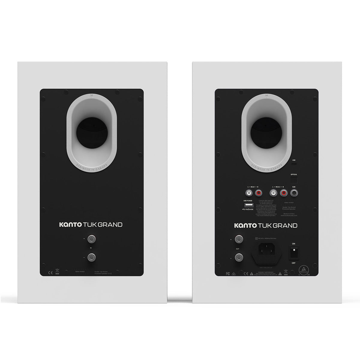 Matte white bookshelf speakers with rear-facing ports and multiple input connections