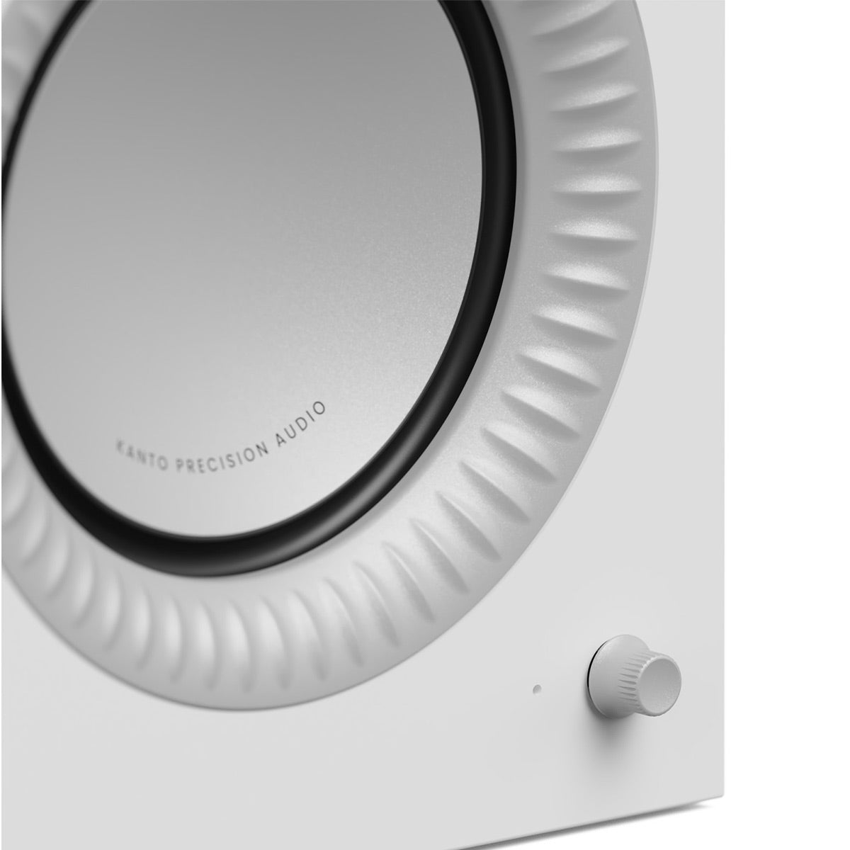 Matte white bookshelf speaker with a large circular driver and a textured surround
