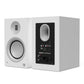 Matte white bookshelf speaker with a front-facing woofer and rear panel featuring multiple input por