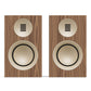 Pair of bookshelf speakers with matte walnut wood veneer cabinets and cream-colored drivers
