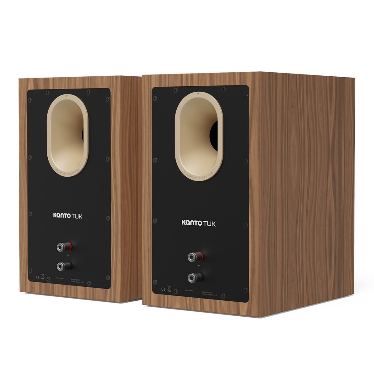 Pair of matte walnut bookshelf speakers with black rear panels and oval ports