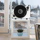 White vertical-standing turntable with a black platter and tonearm