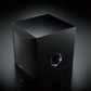 Black cube-shaped subwoofer with a front-facing circular port and textured finish